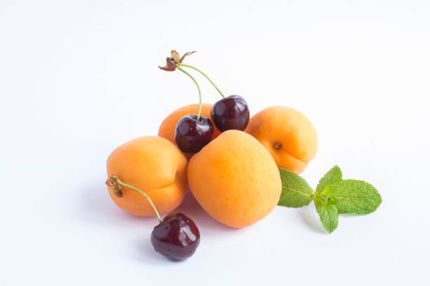 Close-up on fruit and berry on the white background. Copy space. stock photo