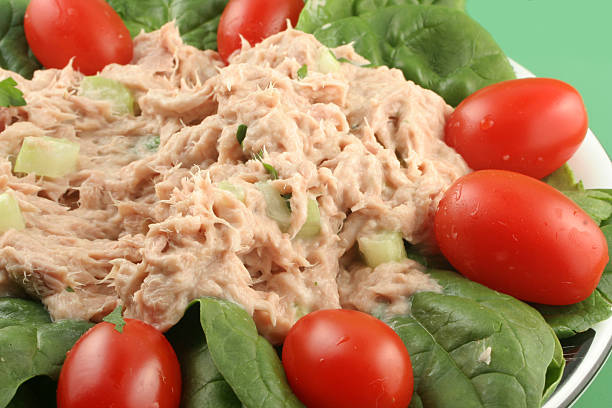 healthy lunch of tuna salad with cherry tomatoes and spinach