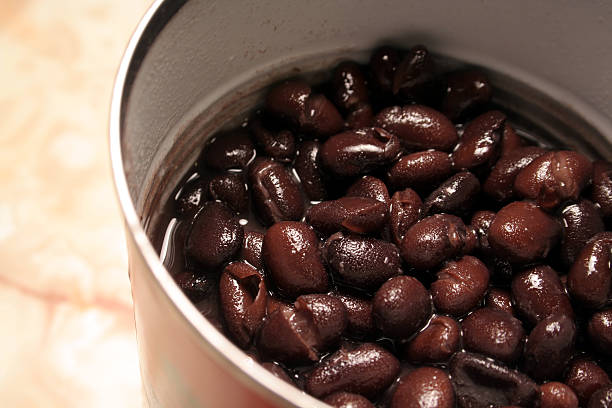 Close-up opened can of black beans stock photo