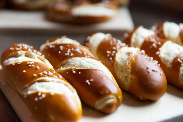 Closeup photo of lye bun and bavarian pretzel in bakery stock photo