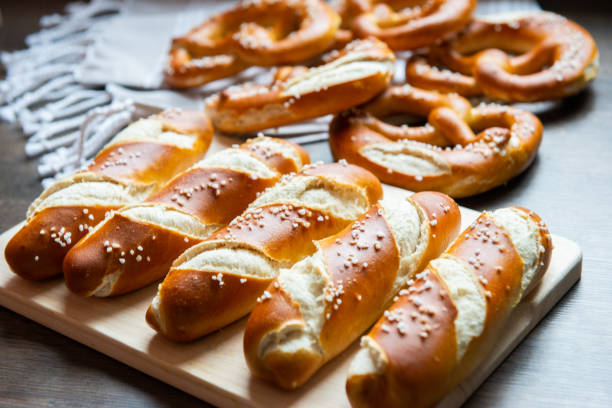 Closeup photo of lye bun and bavarian pretzel in bakery stock photo