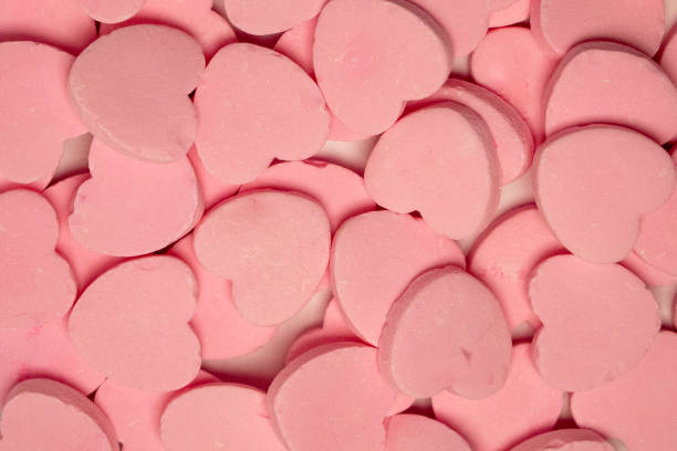 closeup pile valentines day sour candy heart shape heap treats food display stock photo