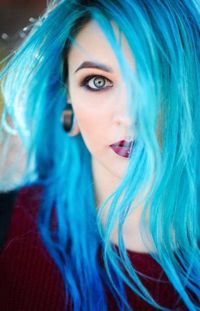Closeup portrait of beautiful young woman with blue hair stock photo