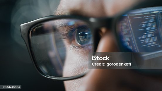 istock Close-up Portrait of Software Engineer Working on Computer, Line of Code Reflecting in Glasses. Developer Working on Innovative e-Commerce Application using Machine Learning, AI Algorithm, Big Data 1355638834