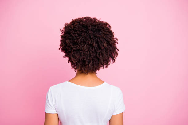 Close-up rear back behind view portrait of her she nice-looking well-groomed attractive wavy-haired girl after salon procedure isolated over pink pastel background Close-up rear back behind view portrait of her she nice-looking well-groomed attractive wavy-haired girl after salon procedure isolated over pink pastel background. afro hairstyle stock pictures, royalty-free photos & images