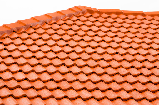 Closeup roof with red terracotta tiles, full frame horizontal composition with copy space