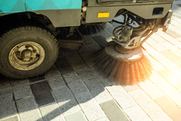 Close-up street sweeper machine cleaning in the morning. stock photo
