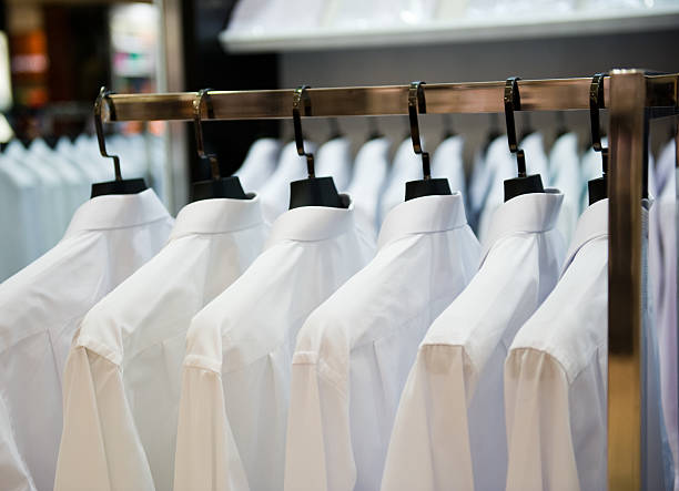 cloth hangers with shirts stock photo