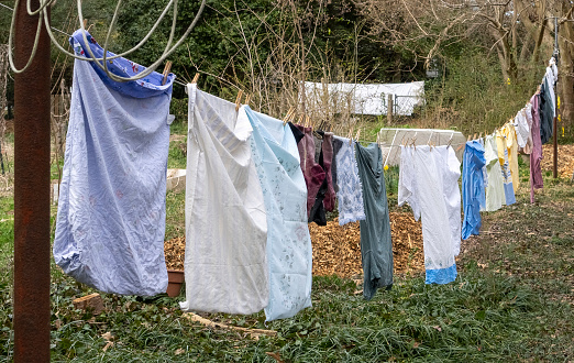 Clothes drying on a clothesline in rural setting.