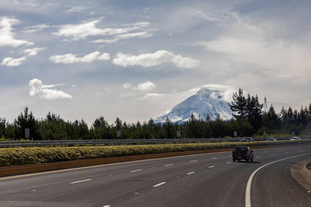 A cloudly long highway in Ecuador stock photo