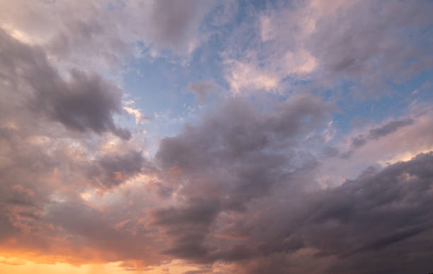 Clouds Storm Clouds at Sunset with an orange sky overcast stock pictures, royalty-free photos & images