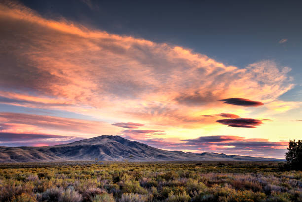 Cloudscape at Sunrise over Virginia Mountain in Nothern Nevada Horizontal High Dynamic Range Color image of a sunrise in Northern Nevada nevada stock pictures, royalty-free photos & images