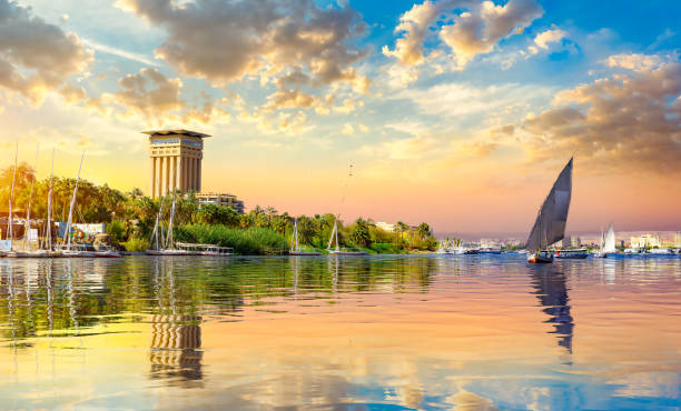 Cloudy sunset over Nile Cloudy sunset over river Nile in Aswan, Egypt aswan egypt stock pictures, royalty-free photos & images