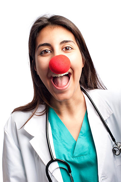 clown doctor having fun clown doctor having fun isolated on white background clown's nose stock pictures, royalty-free photos & images