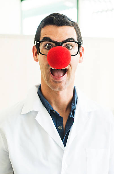 Clown Doctor Making a Face Clown Doctor Making a Face clown's nose stock pictures, royalty-free photos & images