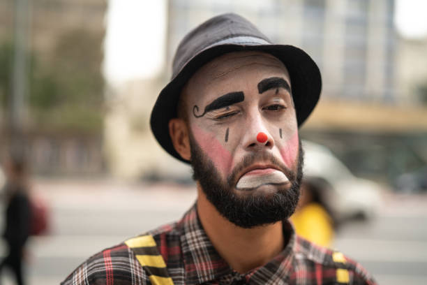 Clown Makes Funny Face Humor mime artist stock pictures, royalty-free photos & images