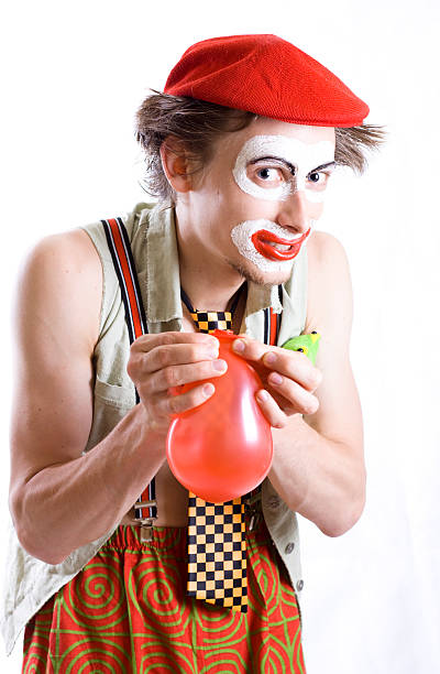 clown with a balloon stock photo