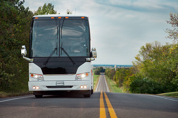 Coach Bus Charter Coach bus on highway bus stock pictures, royalty-free photos & images