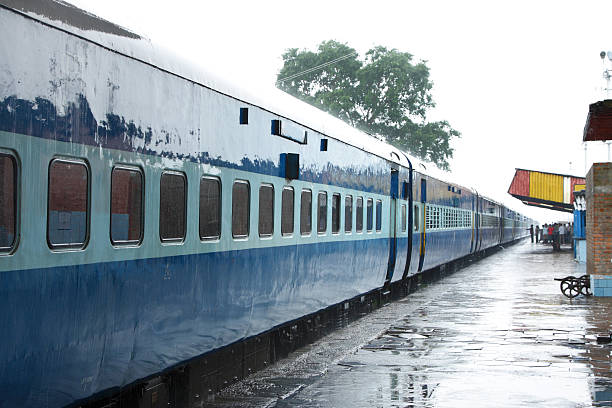 AC coach of Indian train on the station during rain stock photo