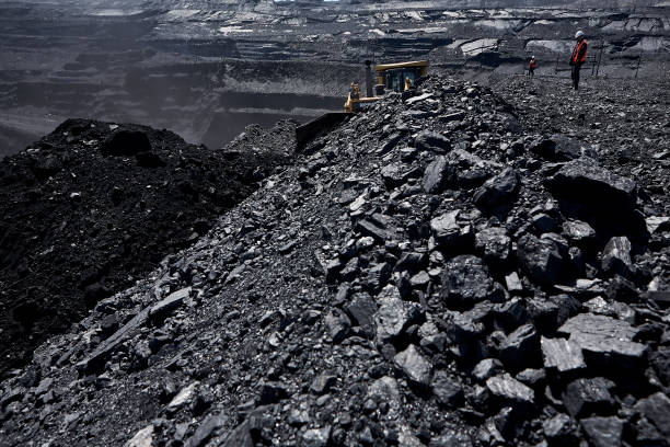 Coal mine in Kazakstan Big black coal mine with machines coal mine stock pictures, royalty-free photos & images