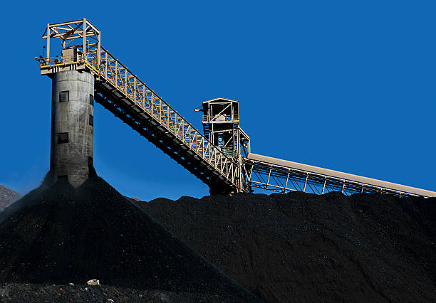 Coal Mining Conveyor Belt and Piles of Coal in Central Colorado Mine. coal mine stock pictures, royalty-free photos & images