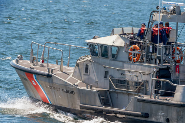 U.S. Coast Guard 47-foot motor lifeboat Menemsha heading out of New Bedford stock photo