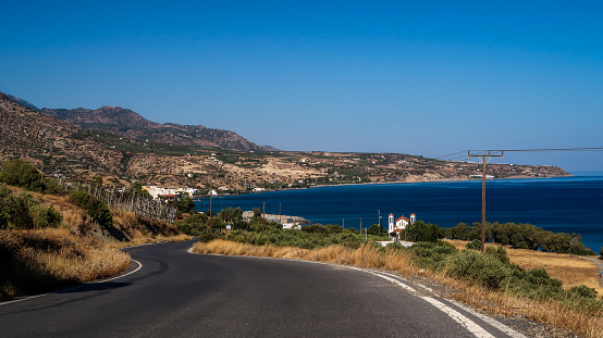 Coastline and a curving road in Keratokampos, Crete