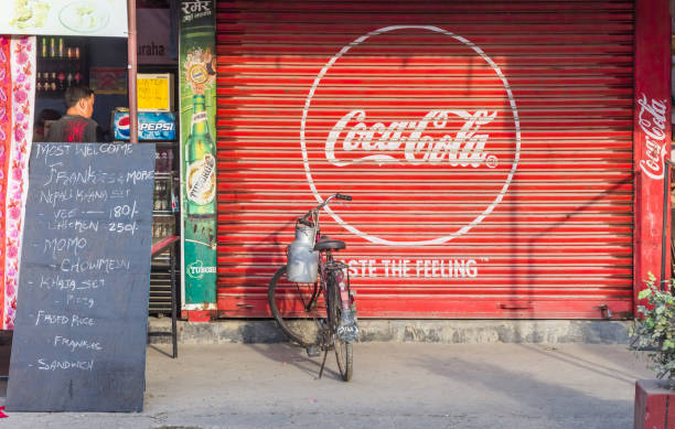 Coca Cola logo on the facade of a store in Sauraha stock photo