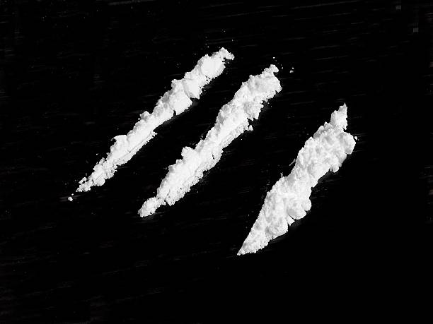 Cocaine drug powder on black background Cocaine drug powder on black background cocaine stock pictures, royalty-free photos & images
