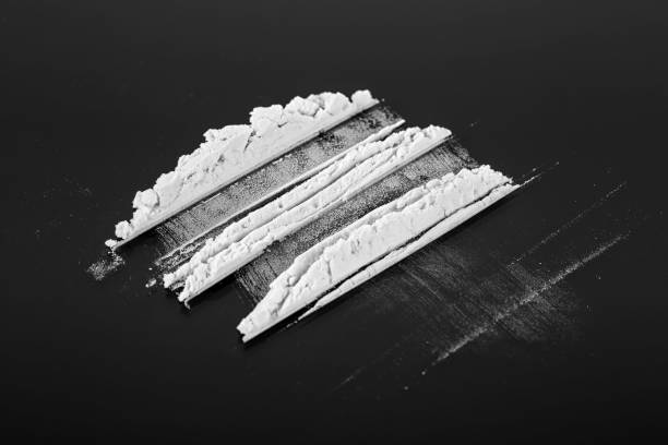 Cocaine powder on a black background Cocaine powder on a black background mephedrone stock pictures, royalty-free photos & images