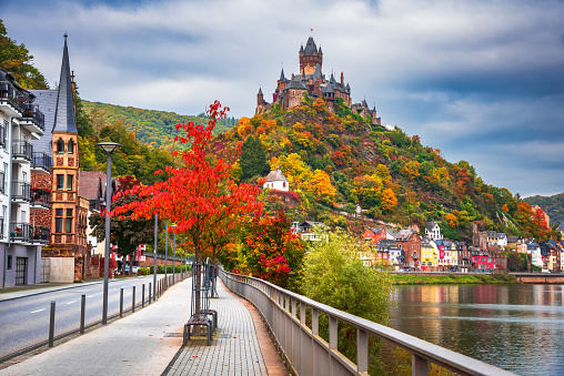 Cochem, Germany. Historical romantic town on Moselle River valley, Rhineland-Palatinate in red autumn colors