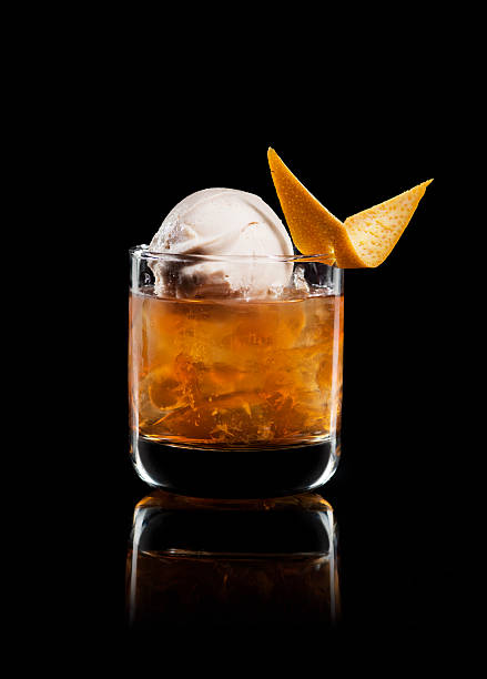 Cocktail Drink. Rum, Ice cream, Orange. Black Background. stock photo