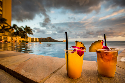 Hawaiian cocktails on Waikiki beach during sunset.