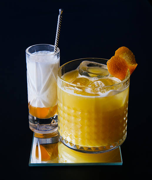Cocktail with orange juice Cocktail with orange juice and vodka on black background screwdriver drink stock pictures, royalty-free photos & images