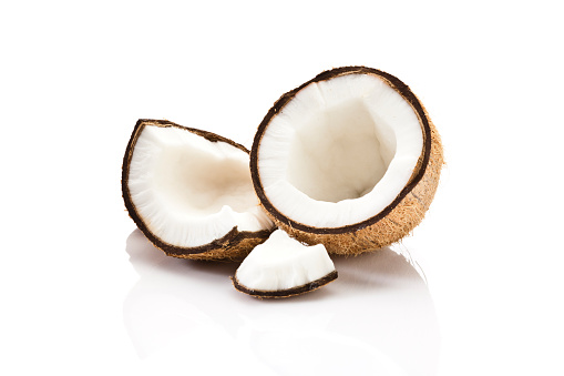 Cracked coconut fruit isolated on white background