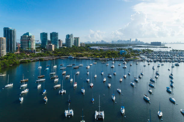 Coconut Grove Bay Panoramic view of Coconut Grove bay with a large group of boats anchored on the shore. Aerial view. grove photos stock pictures, royalty-free photos & images