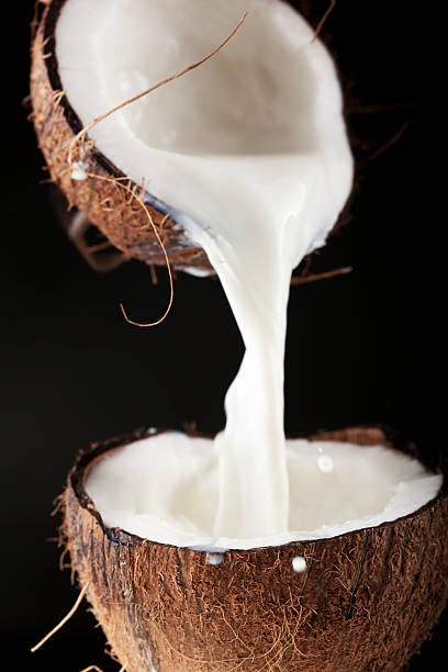 Coconut with milk Coconut with milk coconut milk stock pictures, royalty-free photos & images