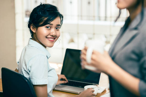 Coffee and women working in office stock photo