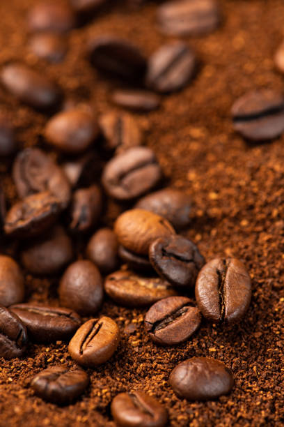 Coffee beans and ground coffee background stock photo