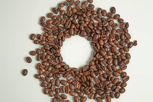 coffee beans close-up. roasted coffee beans on a white background. stock photo