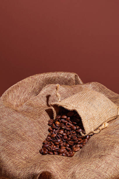 Coffee beans in a small sack stock photo