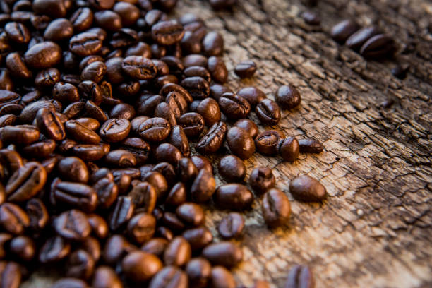 Coffee beans on wood texture background stock photo