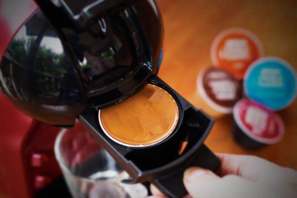 Coffee capsule for home espresso maker machine stock photo