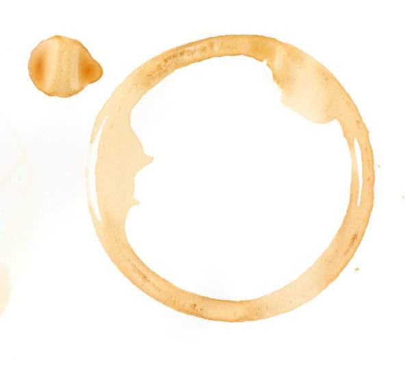 A coffee stain on a white background http://i1301.photobucket.com/albums/ag116/kizilkayaphotos/coffee_zps1b61a3cc.jpg stained stock pictures, royalty-free photos & images