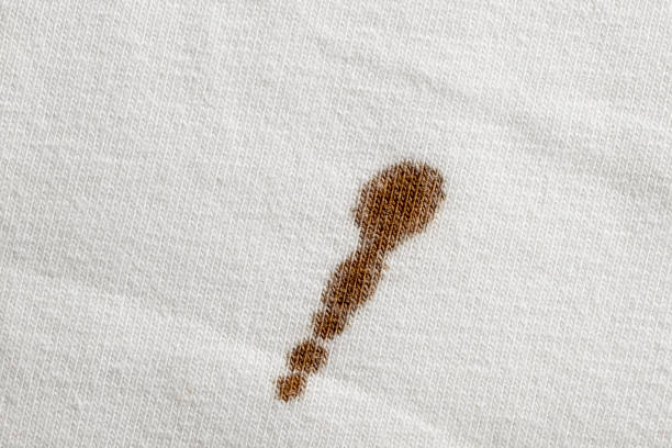 Coffee stain on white cloth stock photo