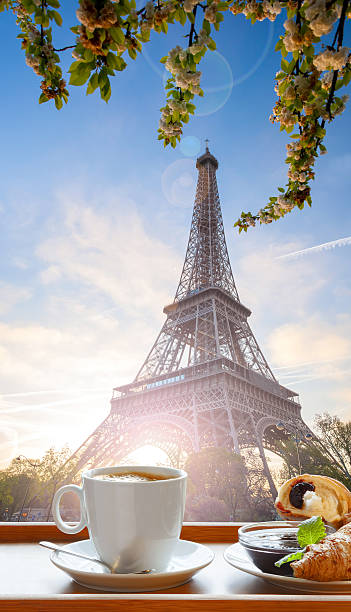 Coffee with croissants against Eiffel Tower in Paris, France stock photo
