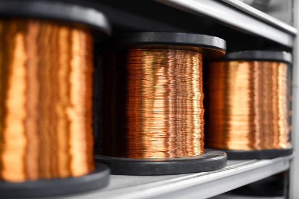 Coils of copper in close up Coils of shiny copper on shelf in close up view copper stock pictures, royalty-free photos & images
