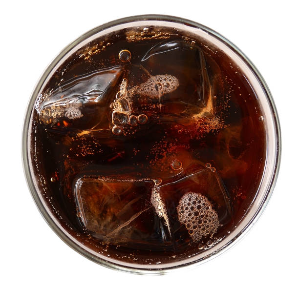 Cola with ice cubes in glass top view isolated on white background, clipping path included Cola with ice cubes in glass top view isolated on white background, clipping path included cola stock pictures, royalty-free photos & images