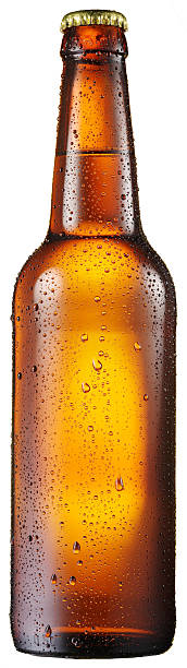 Cold bottle of beer with condensated water drops on it. stock photo