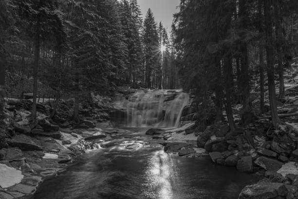 Cold morning with Mumlavske waterfalls near Harrachov town in Krkonose mountains stock photo